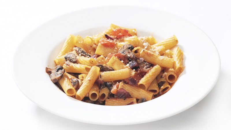 Rigatoni pasta in tomato sauce with aubergine, mozzarella and fresh basil
